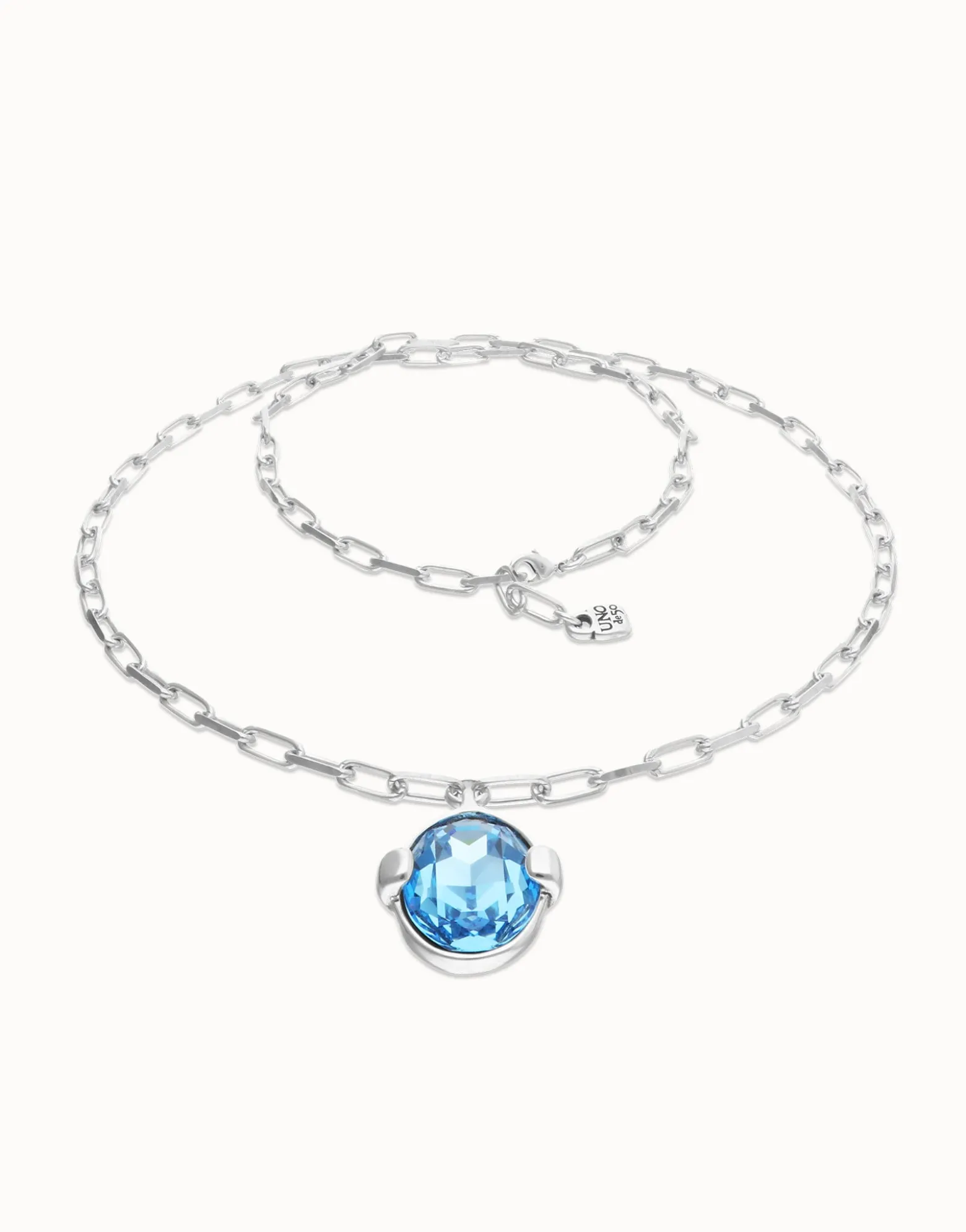 Long necklace with large blue oval faceted crystal