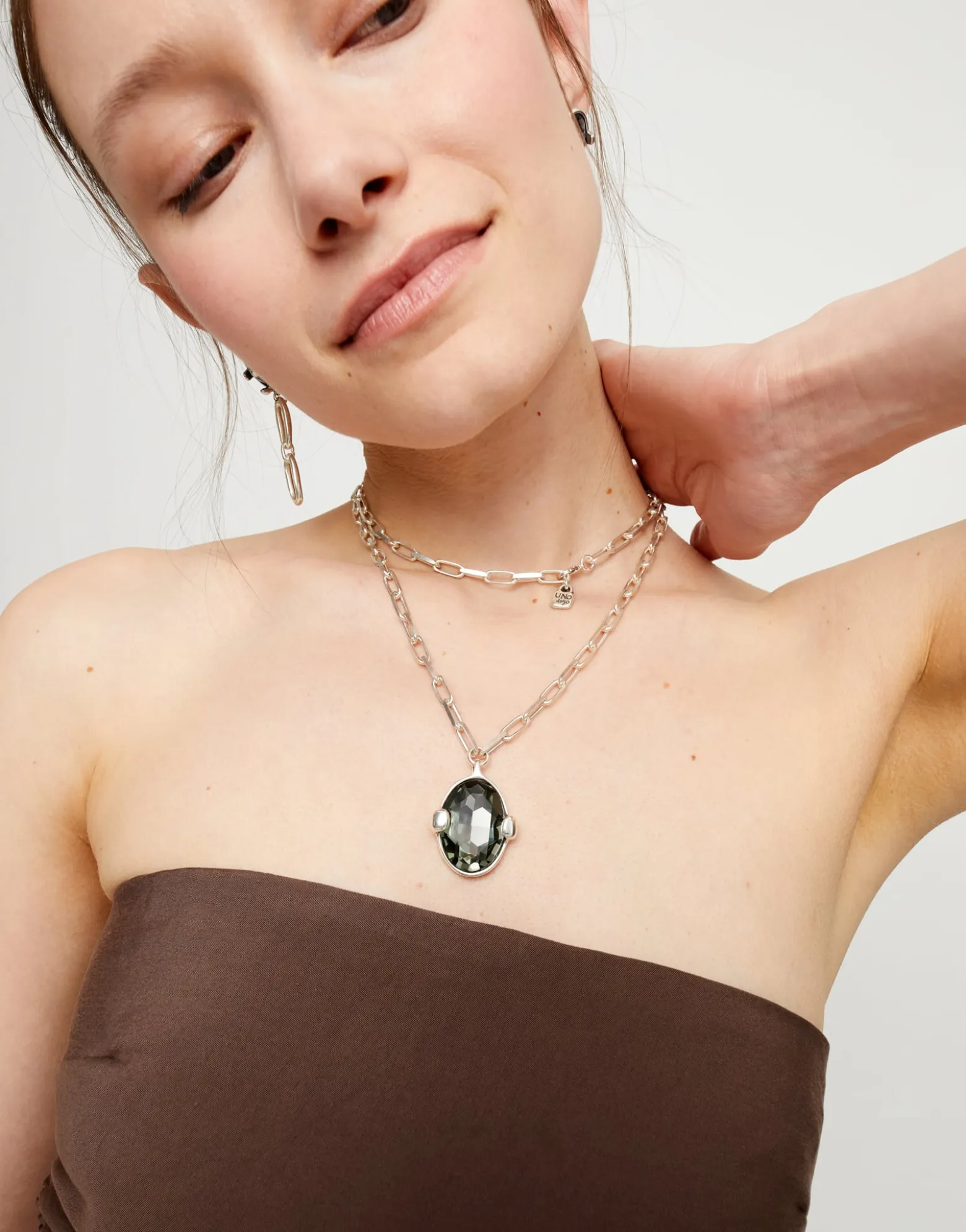 Long necklace with large gray oval faceted crystal