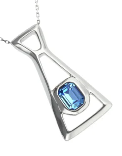 Long necklace with pendant and rectangular blue faceted crystal