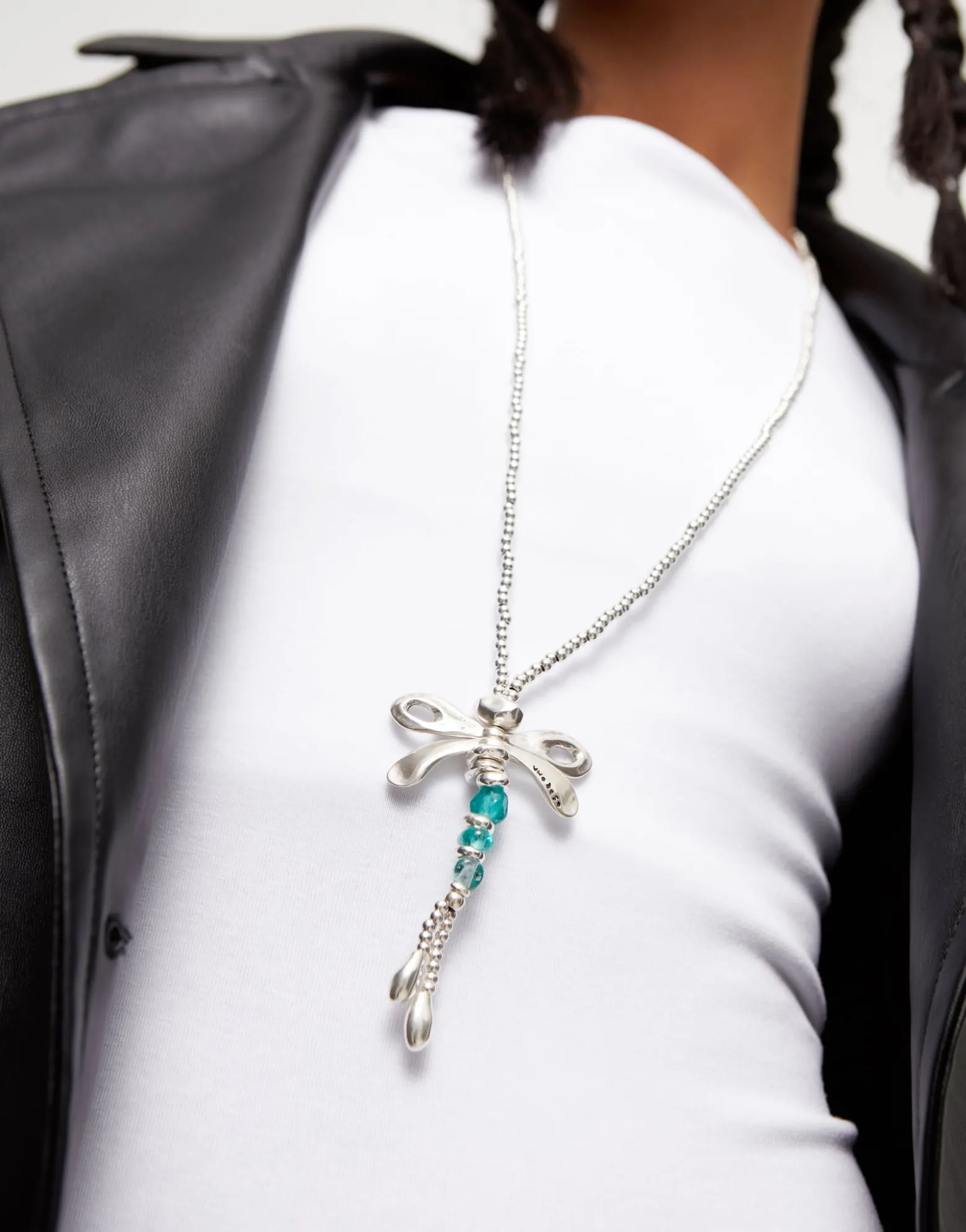 Long pendant necklace with a dragonfly