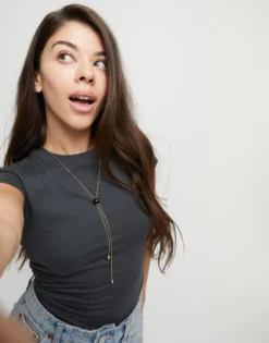 Long pendant necklace with central black murano glass