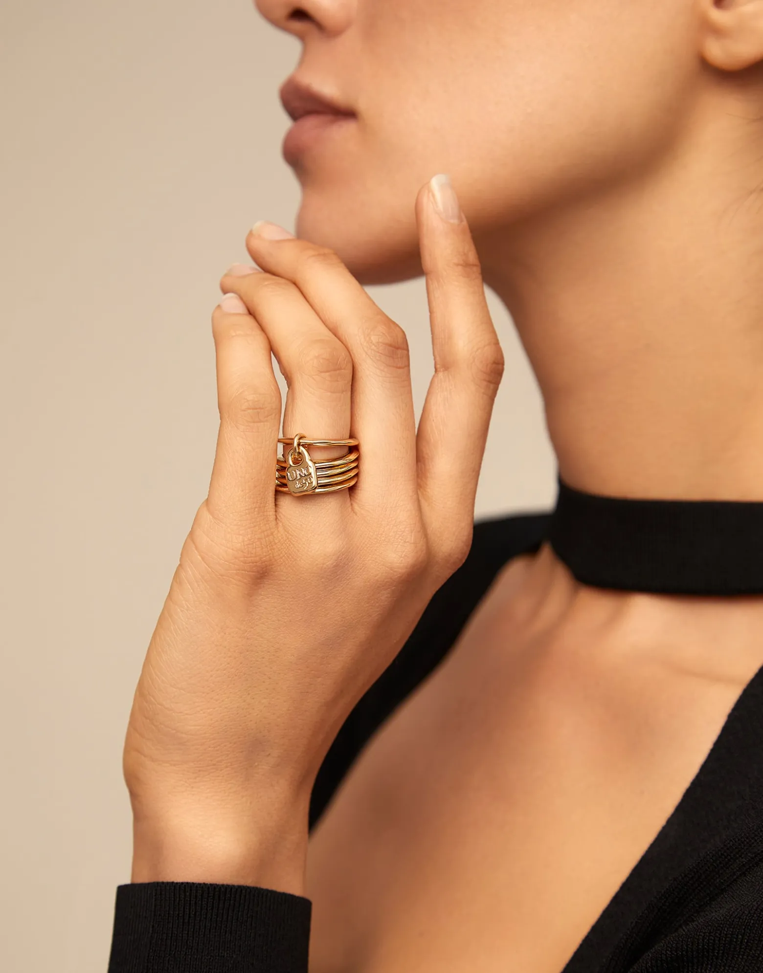Multi row ring with a charm