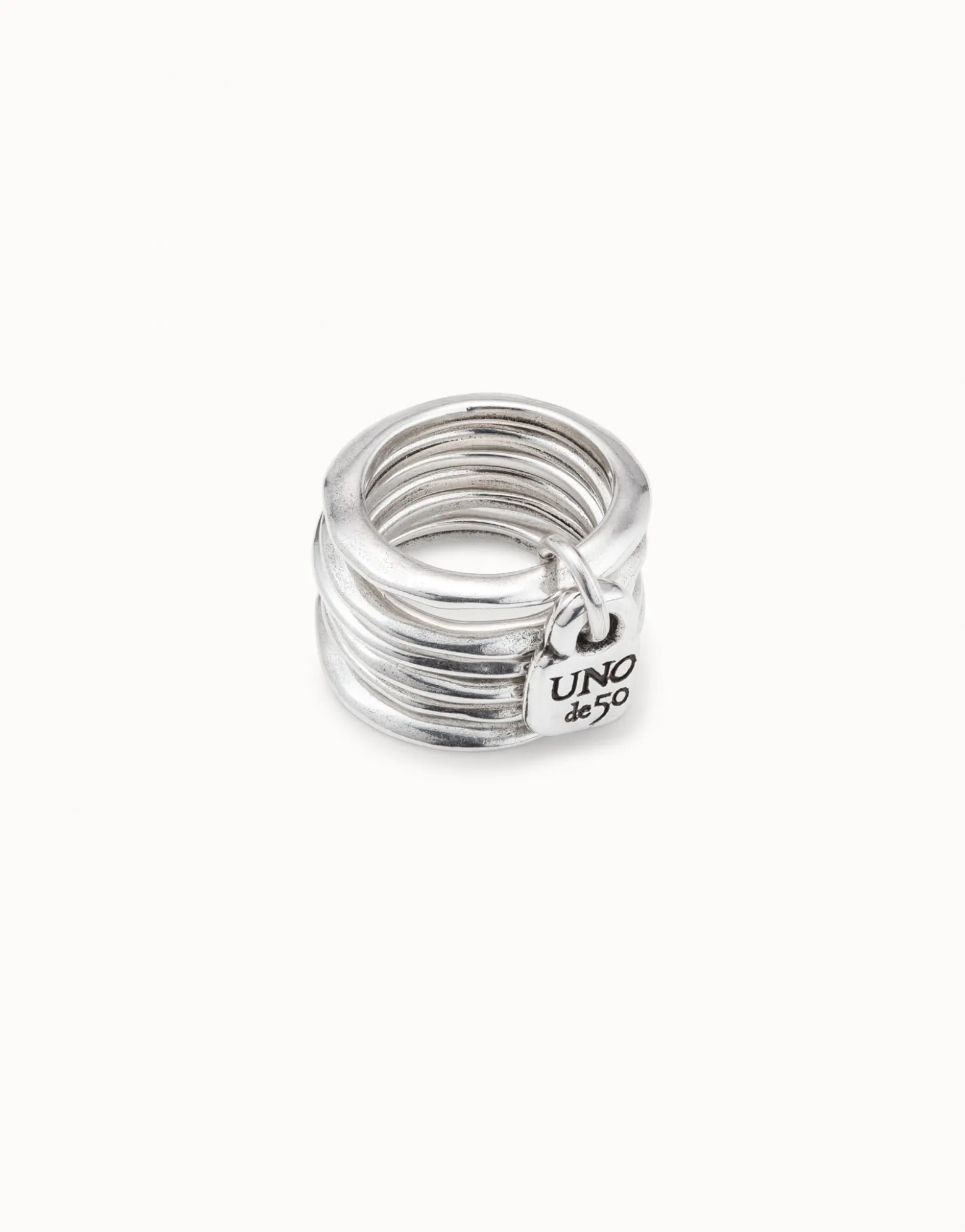 Multi row ring with a charm