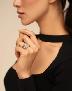Multi row ring with a charm