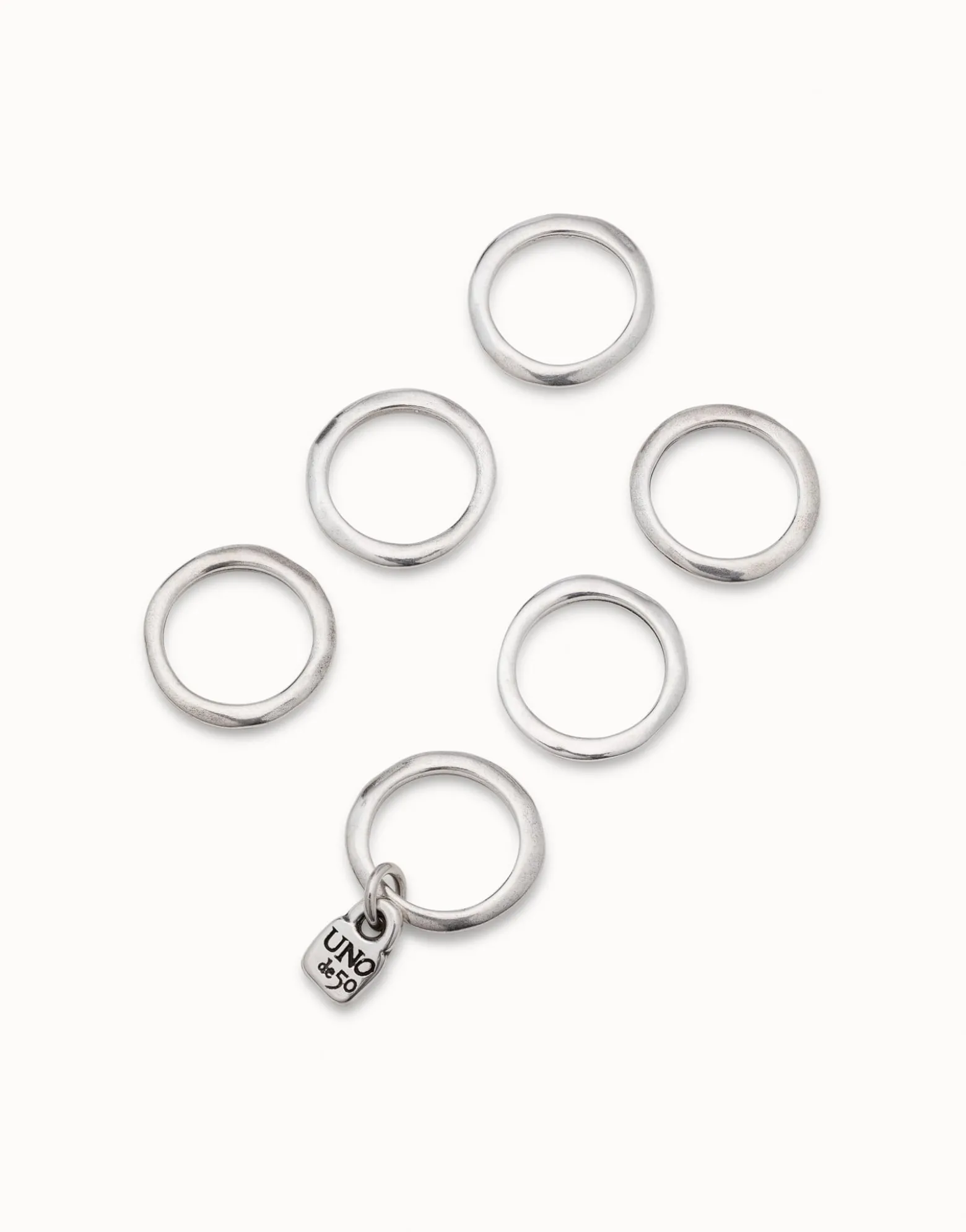 Multi row ring with a charm