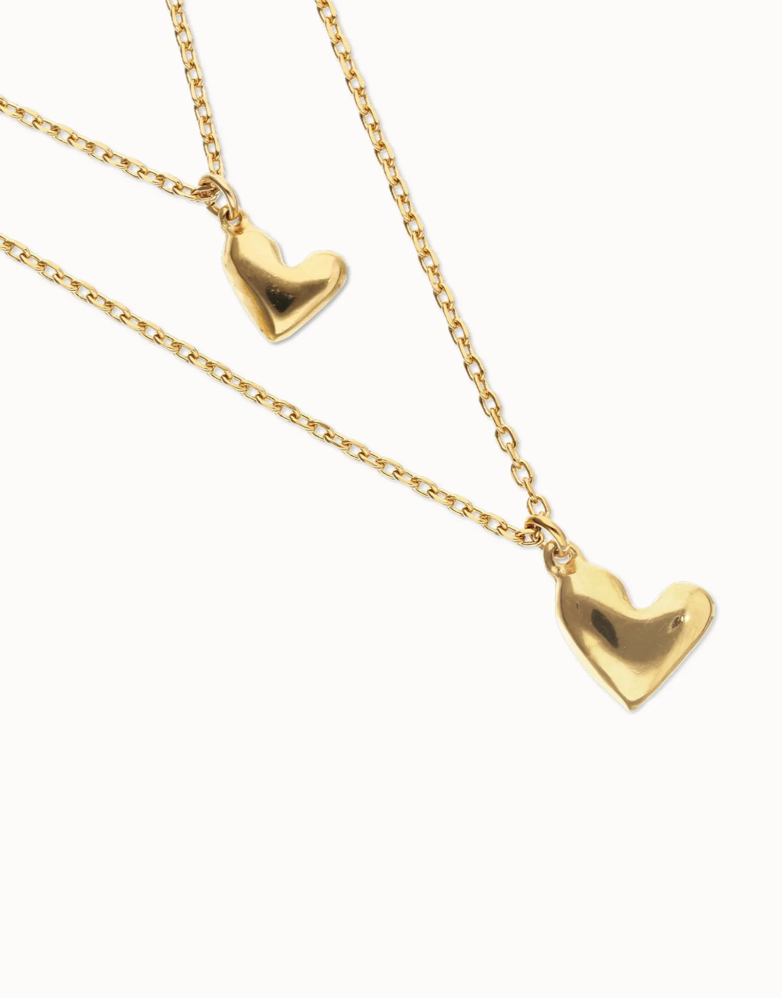 Multi strand chain necklace with two hearts