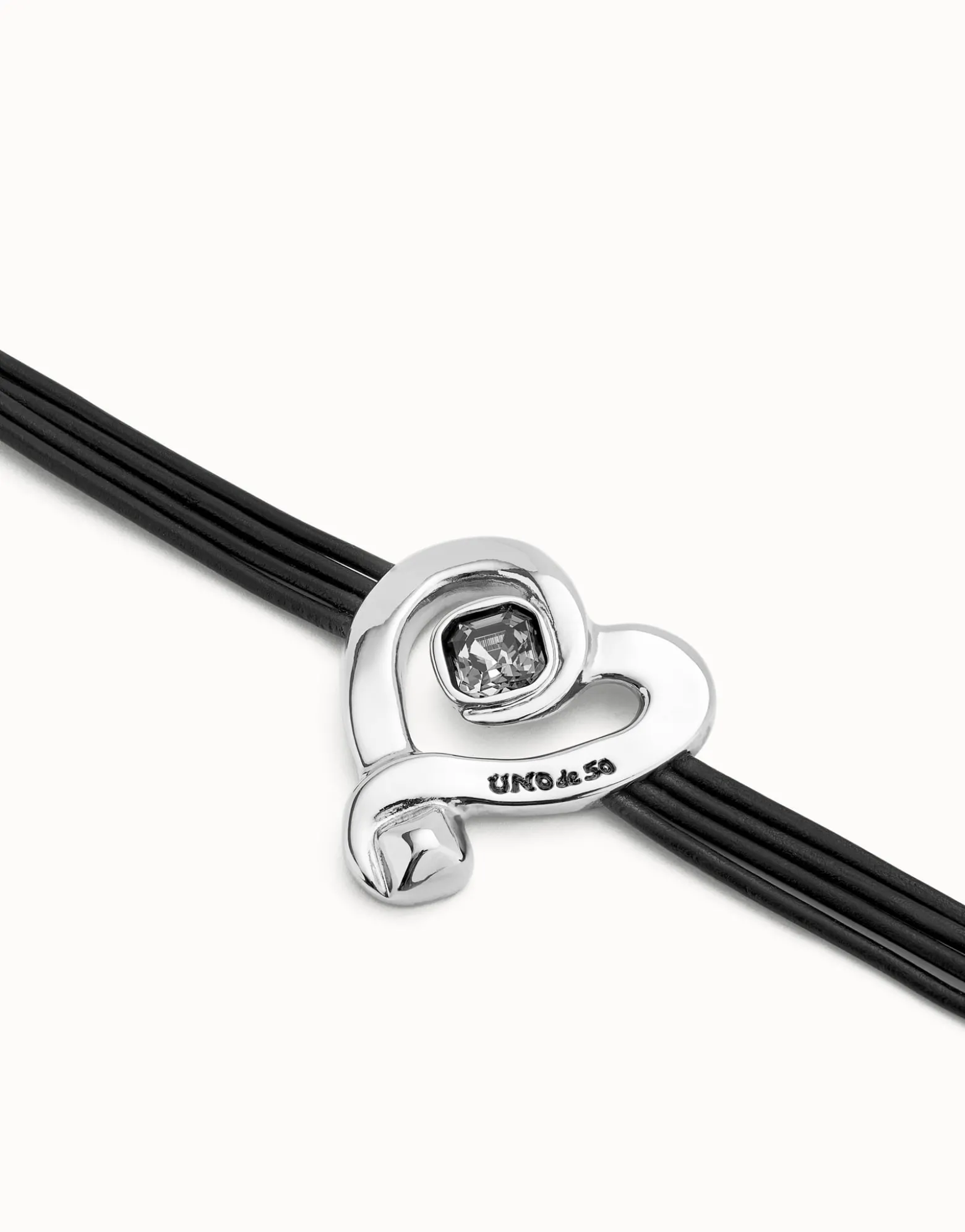 Multi strand leather bracelet with a heart