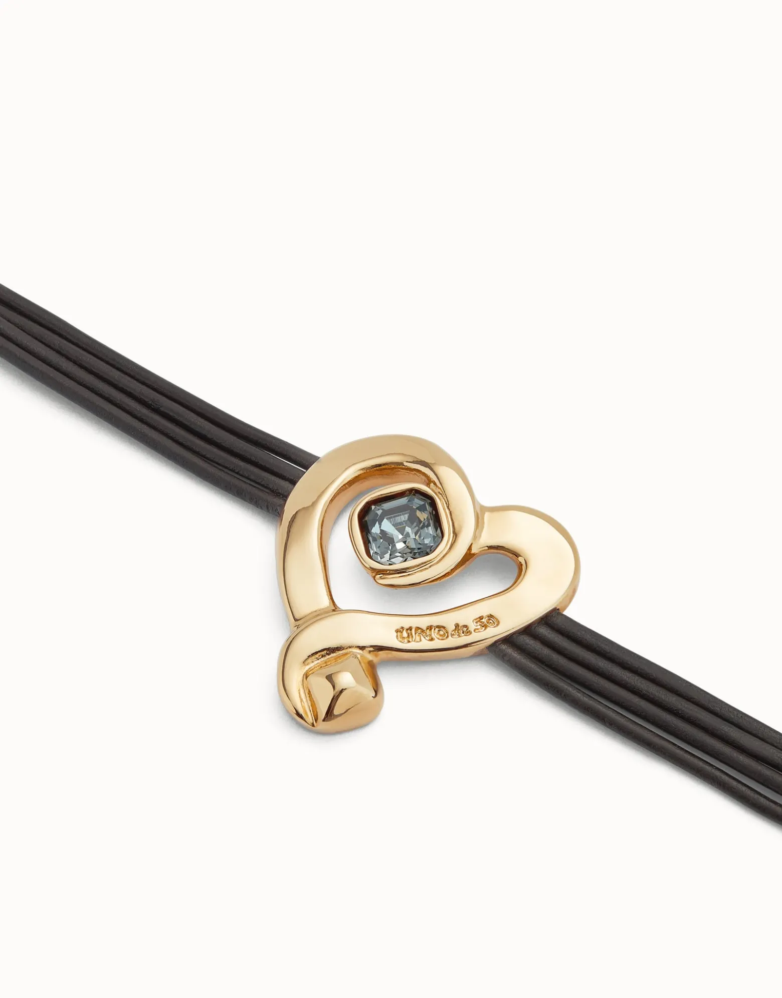 Multi strand leather bracelet with a heart