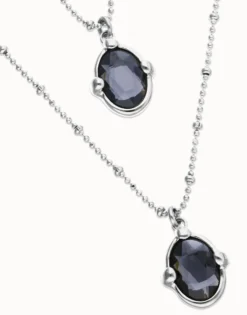 Multi strand necklace with two black oval faceted crystals