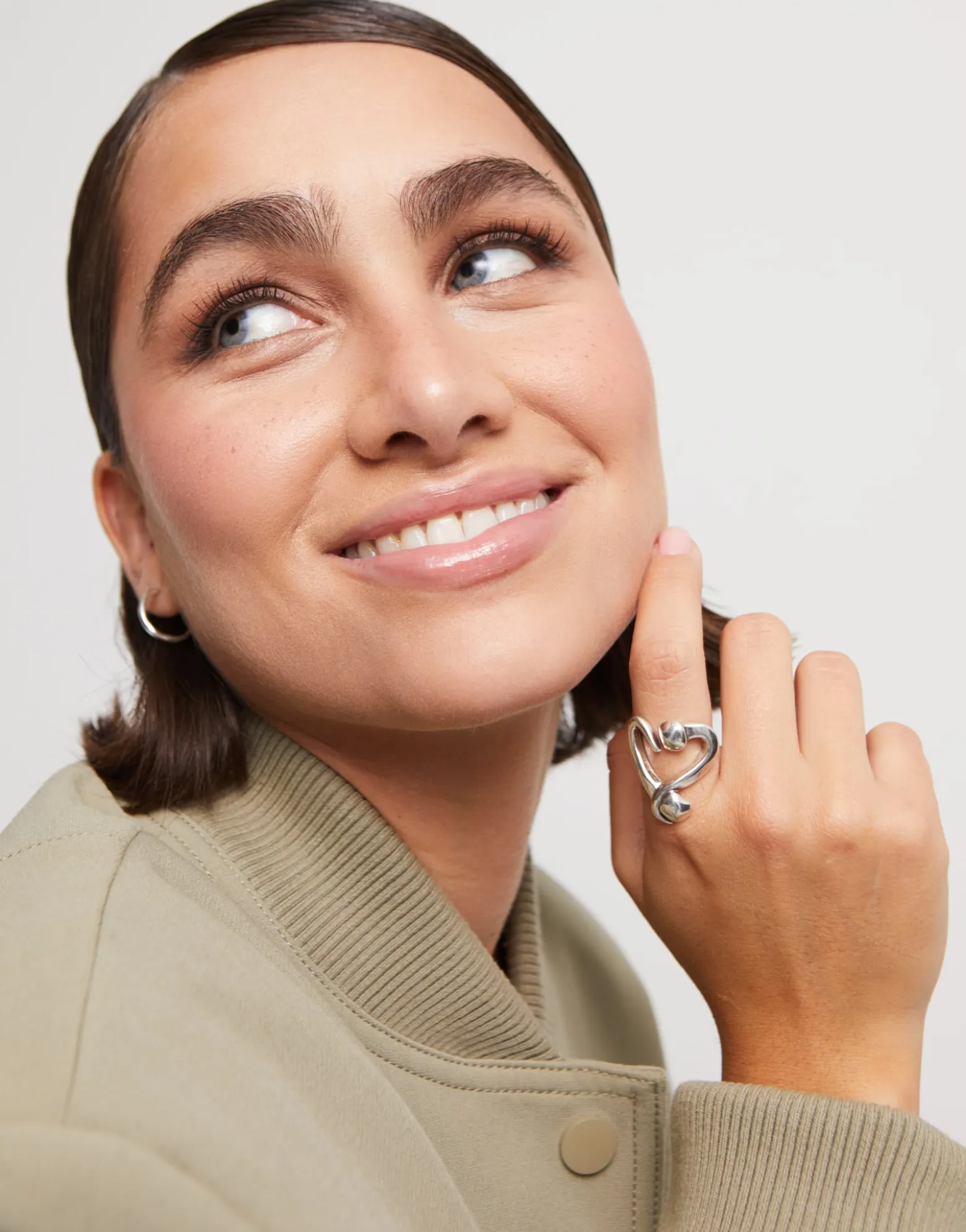Open ring with a nailed heart