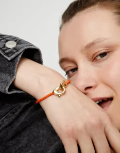 Orange leather bracelet with interlocking carabiner