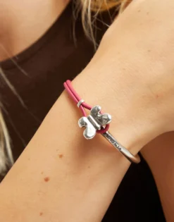 Pink leather bracelet with butterfly ornament