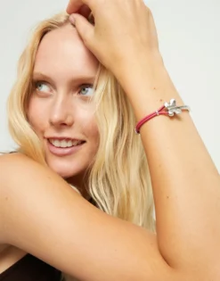 Pink leather bracelet with butterfly ornament