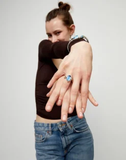 Ring with blue oval faceted crystal