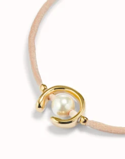 Salmon cord bracelet with a pearl