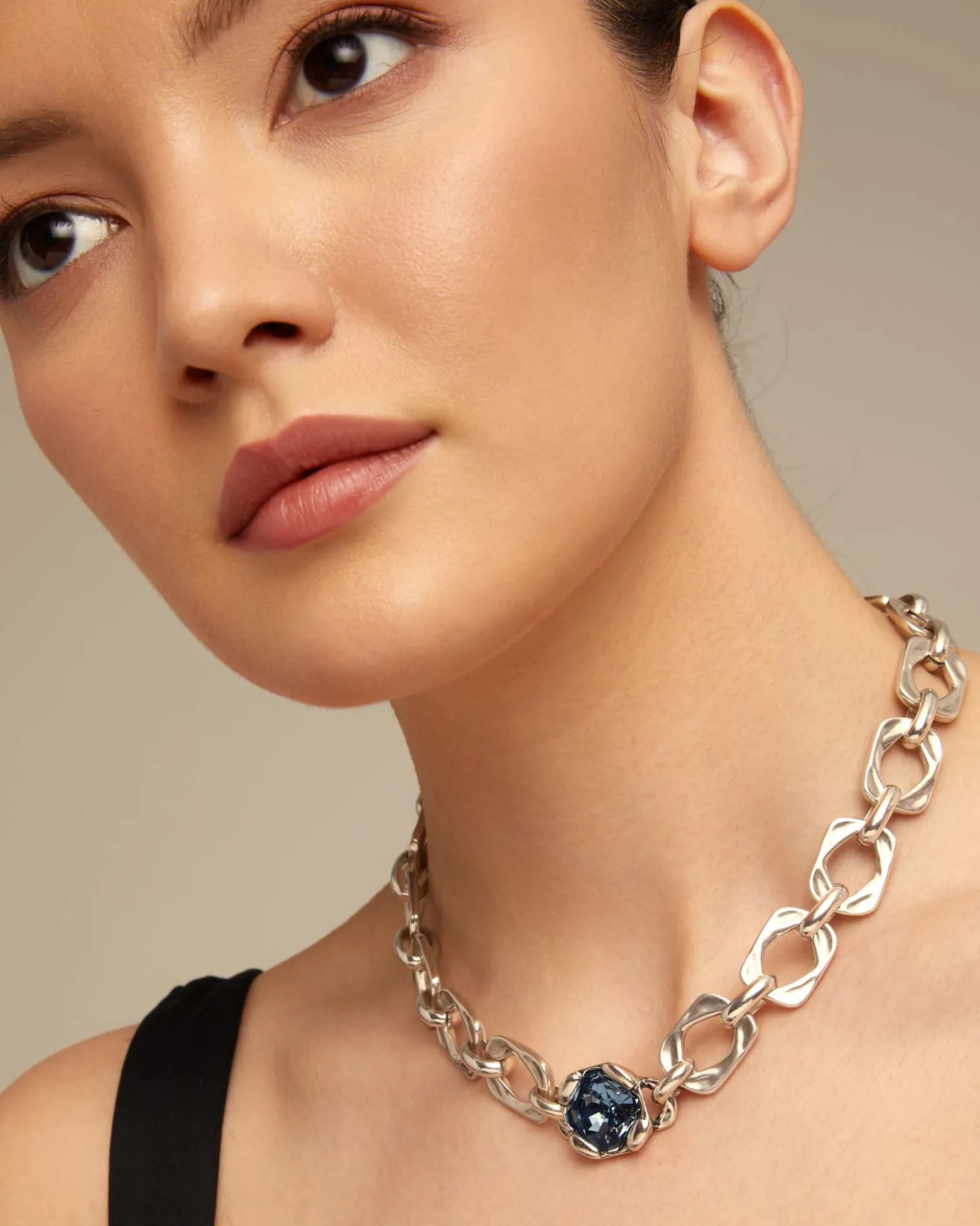 Short link chain necklace with large blue crystal