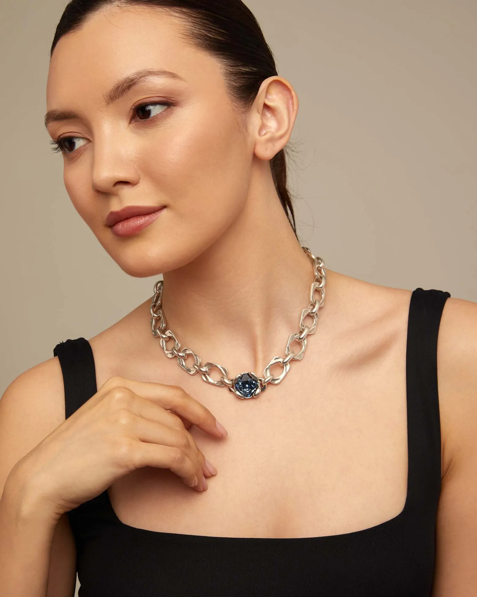 Short link chain necklace with large blue crystal