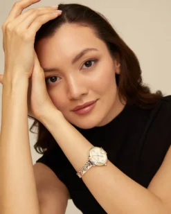 Sterling silver-plated watch with metal strap and round white dial