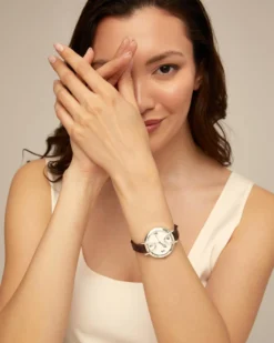 Sterling silver-plated watch with black leather strap and round white dial