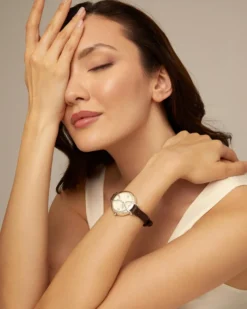 Sterling silver-plated watch with black leather strap and round white dial