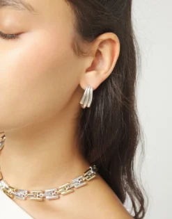 Stud earrings with elongated organic shapes