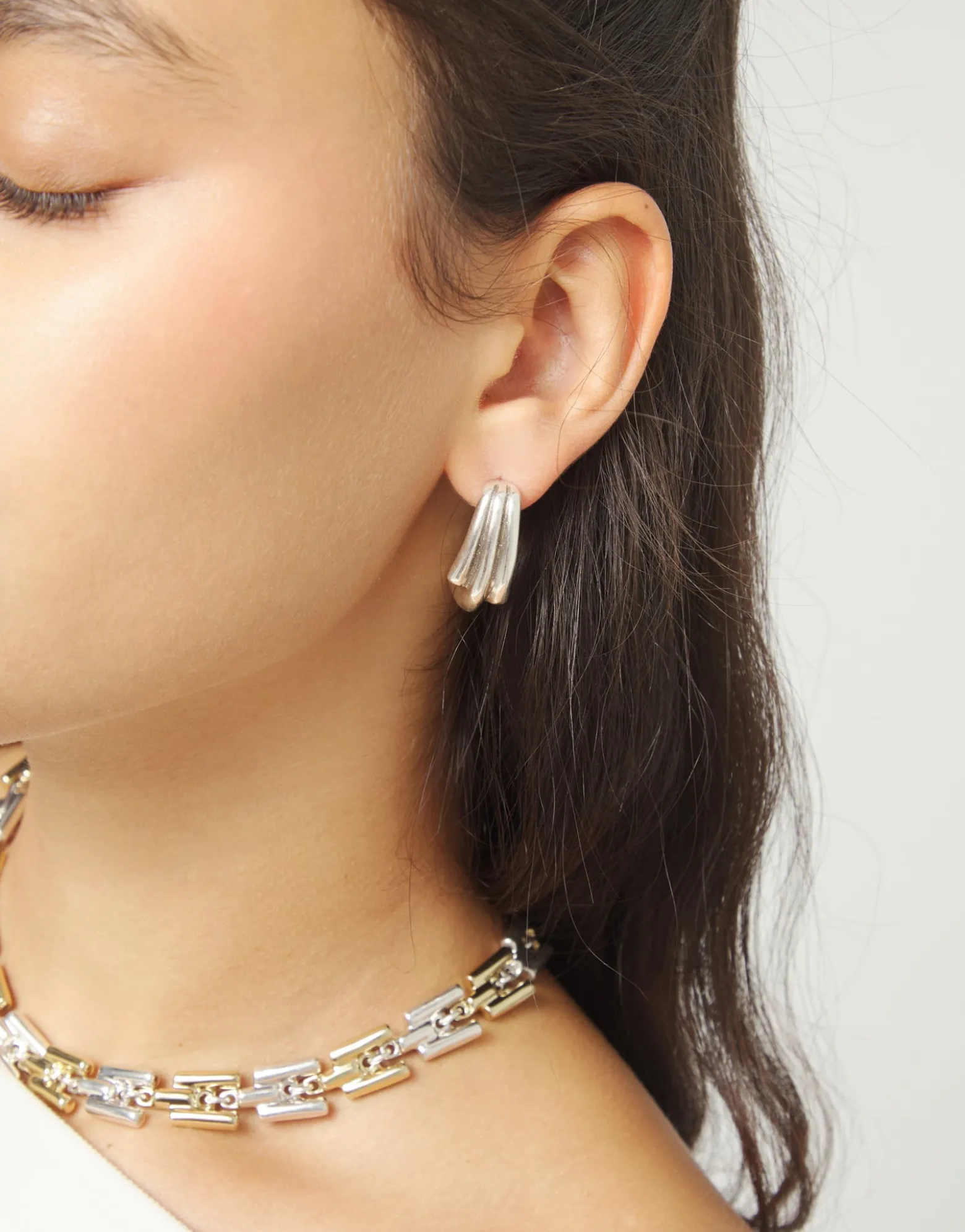 Stud earrings with elongated organic shapes