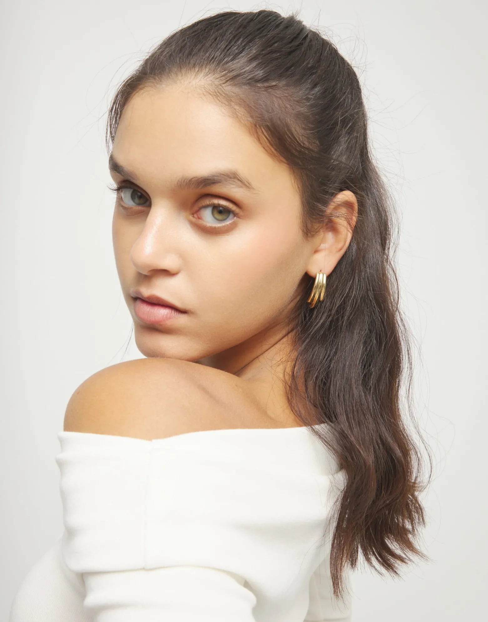 Stud earrings with elongated organic shapes