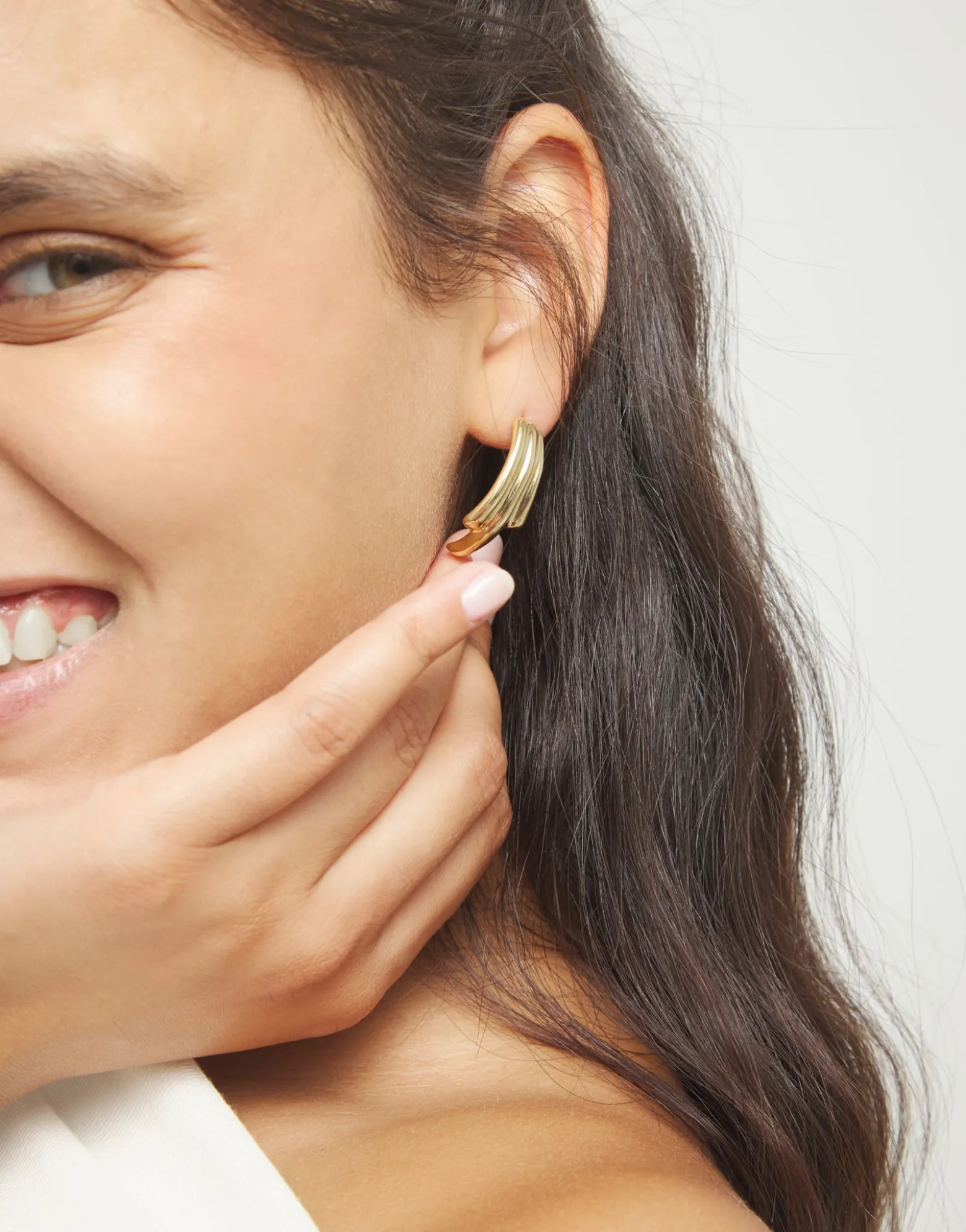 Stud earrings with elongated organic shapes