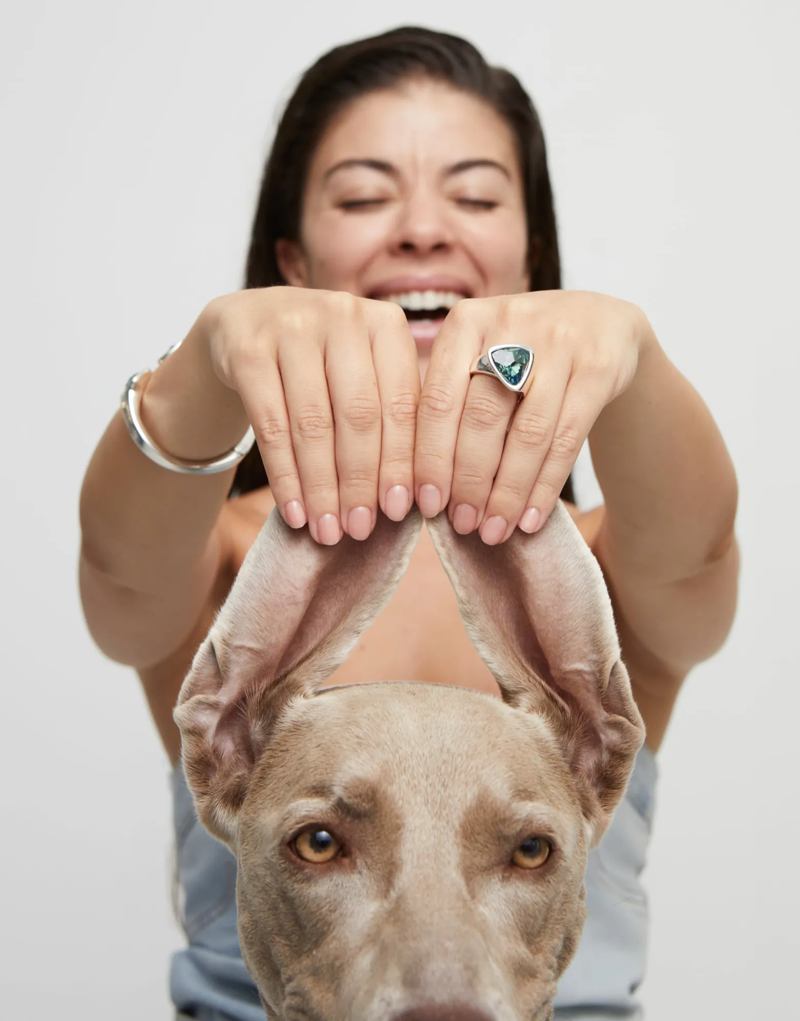 Triangular ring with green crystal