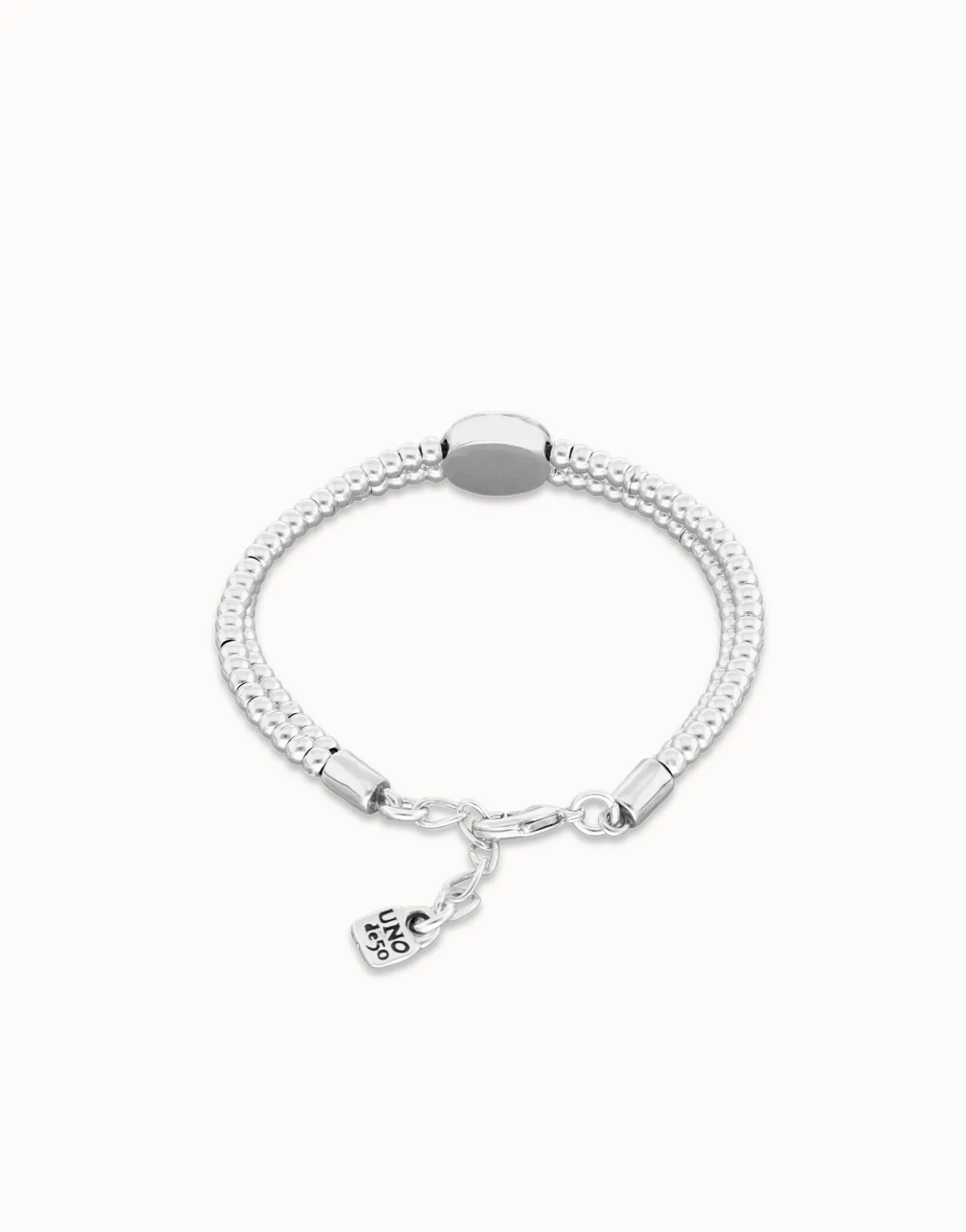 Two-strand beaded bracelet with an eye-shaped charm