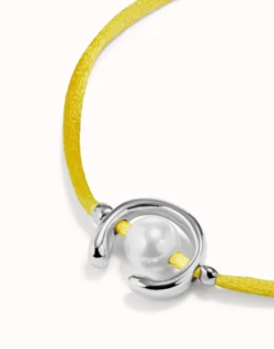 Yellow cord bracelet with a pearl